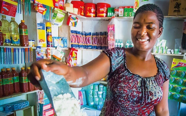Maryam, general store owner, Opportunity Tanzania client, Tanzania. With a hand up, Maryam’s business continues to grow and she is now able to send her daughters to school.